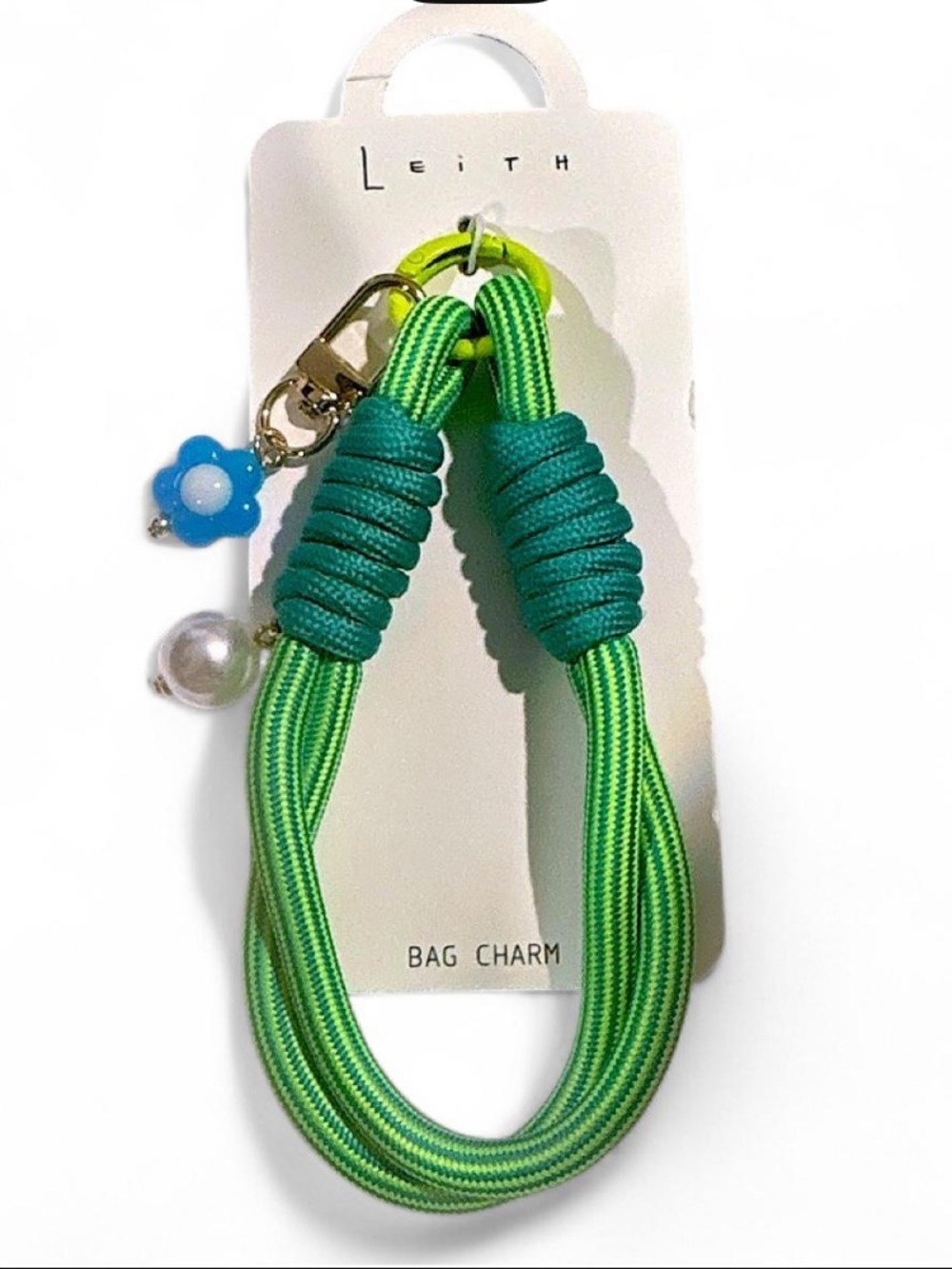 Leith green and teal striped bag charm with pearl and flower detail